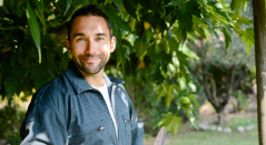 Smiling man standing outside