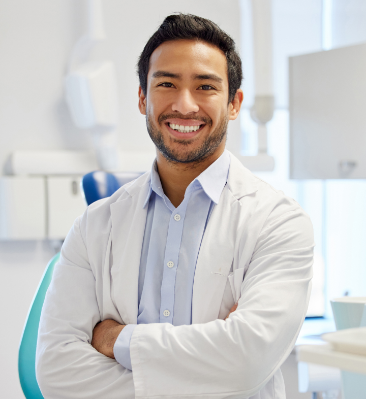 Smiling dentist with his arms crossed